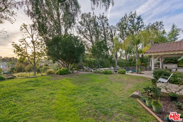 a view of backyard with green space