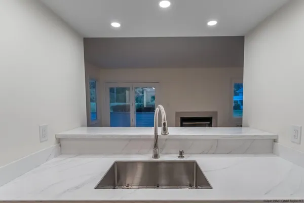 a kitchen with a sink and a refrigerator