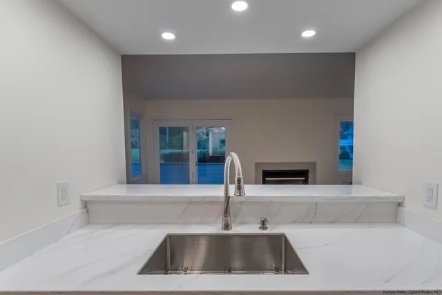 a kitchen with a sink and a refrigerator