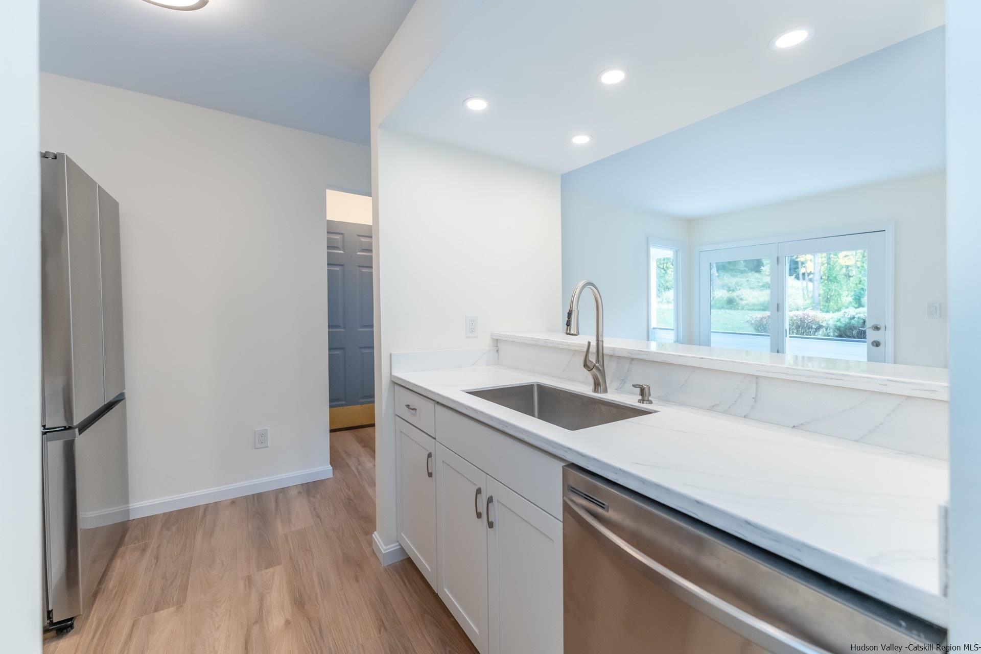 4 Tiger Maple Lane Saugerties, NY 12477 - Photo 16 of 35 a kitchen with a sink and a large window