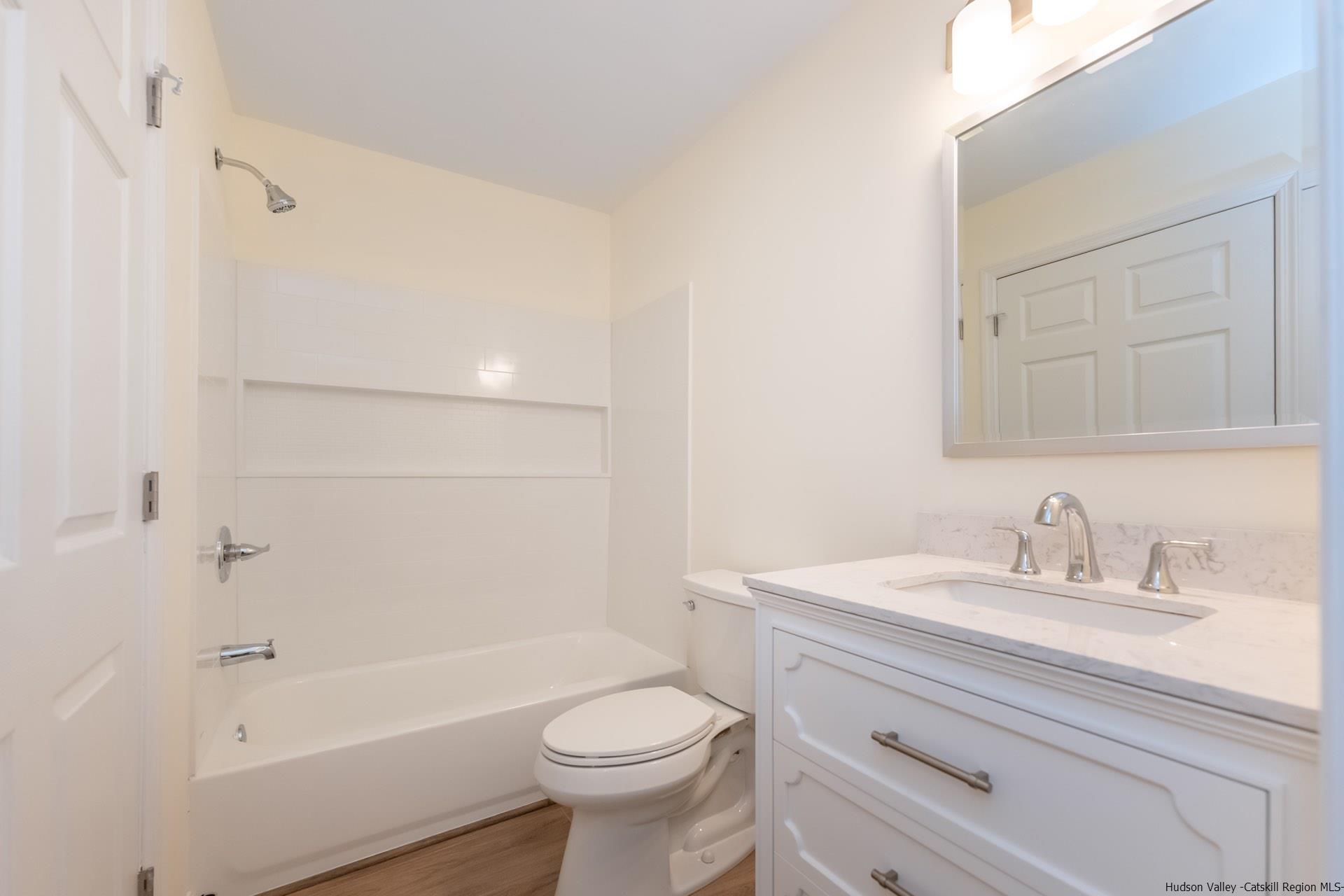 4 Tiger Maple Lane Saugerties, NY 12477 - Photo 24 of 35 a bathroom with a sink a toilet and shower