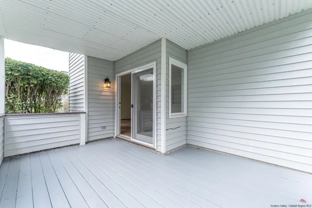 a view of a porch with wooden floor