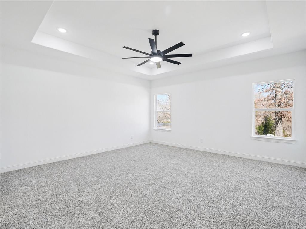 448 Rs County Road Alba, TX 75410 - Photo 23 of 34 an empty room with windows and fan