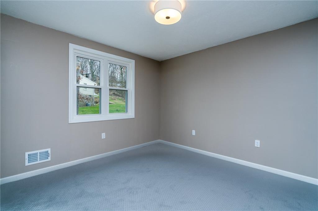 1799 Locust Road Sewickley, PA 15143 - Photo 20 of 25 There are two additional bedrooms on the upper level.