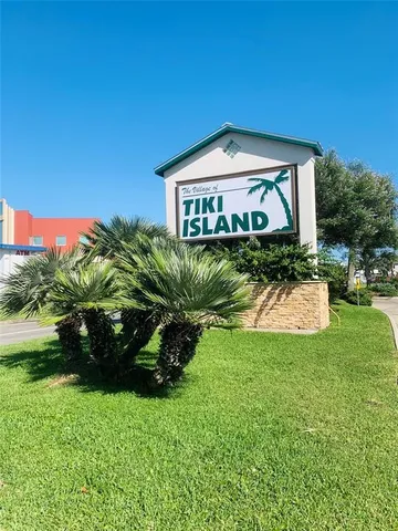 a view of a lake with table and chairs