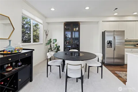 a view of a dining room with furniture and window