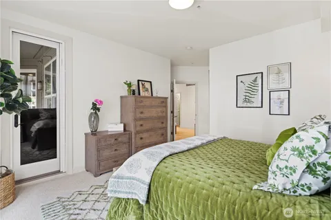 a bedroom with a bed and a mirror