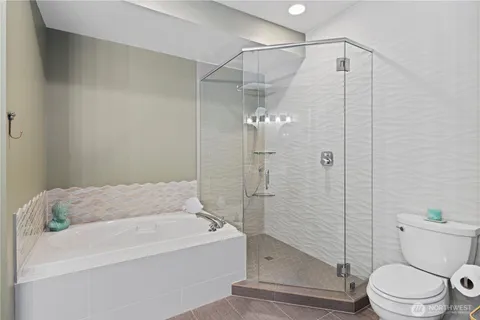 a bathroom with a toilet and shower