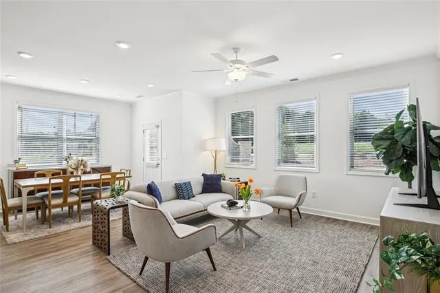 a living room with furniture and a large window