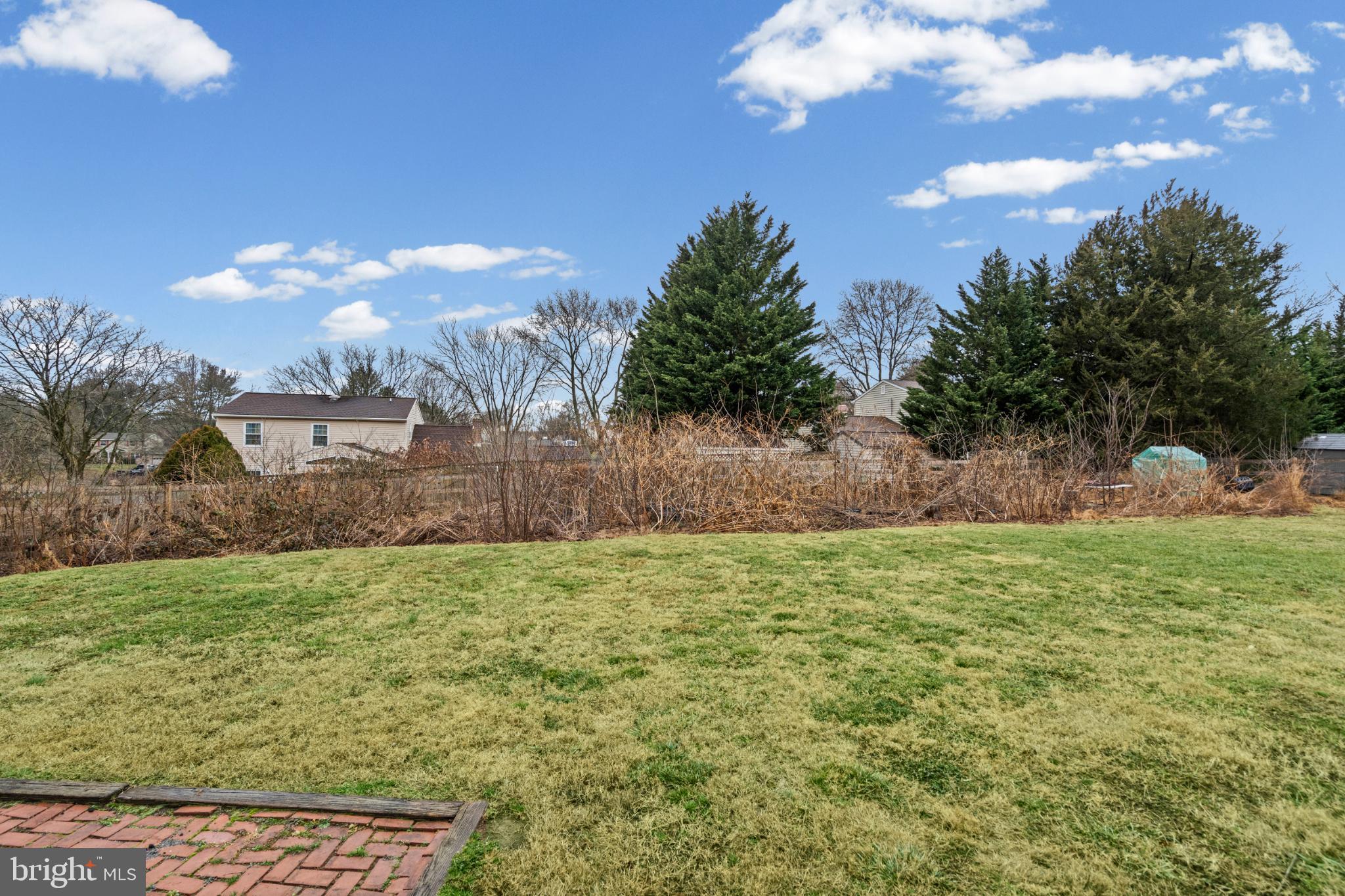 3416 Kreitler Road Forest Hill, MD 21050 - Photo 43 of 45 Spacious yard with lush greenery and blue skies.