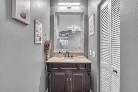 a bathroom with a sink and a mirror