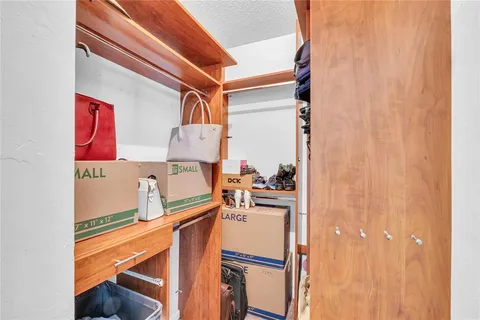 a view of a room with chairs and refrigerator