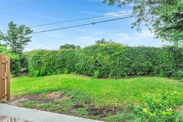 a backyard of a house with lots of green space