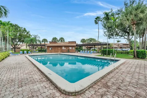 a view of swimming pool with a patio