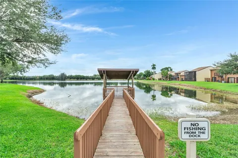 a view of swimming pool with a lake view