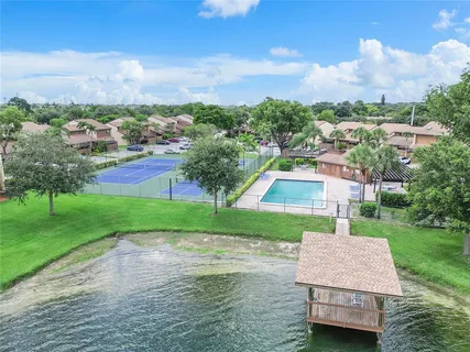 an aerial view of a house with garden space and street view