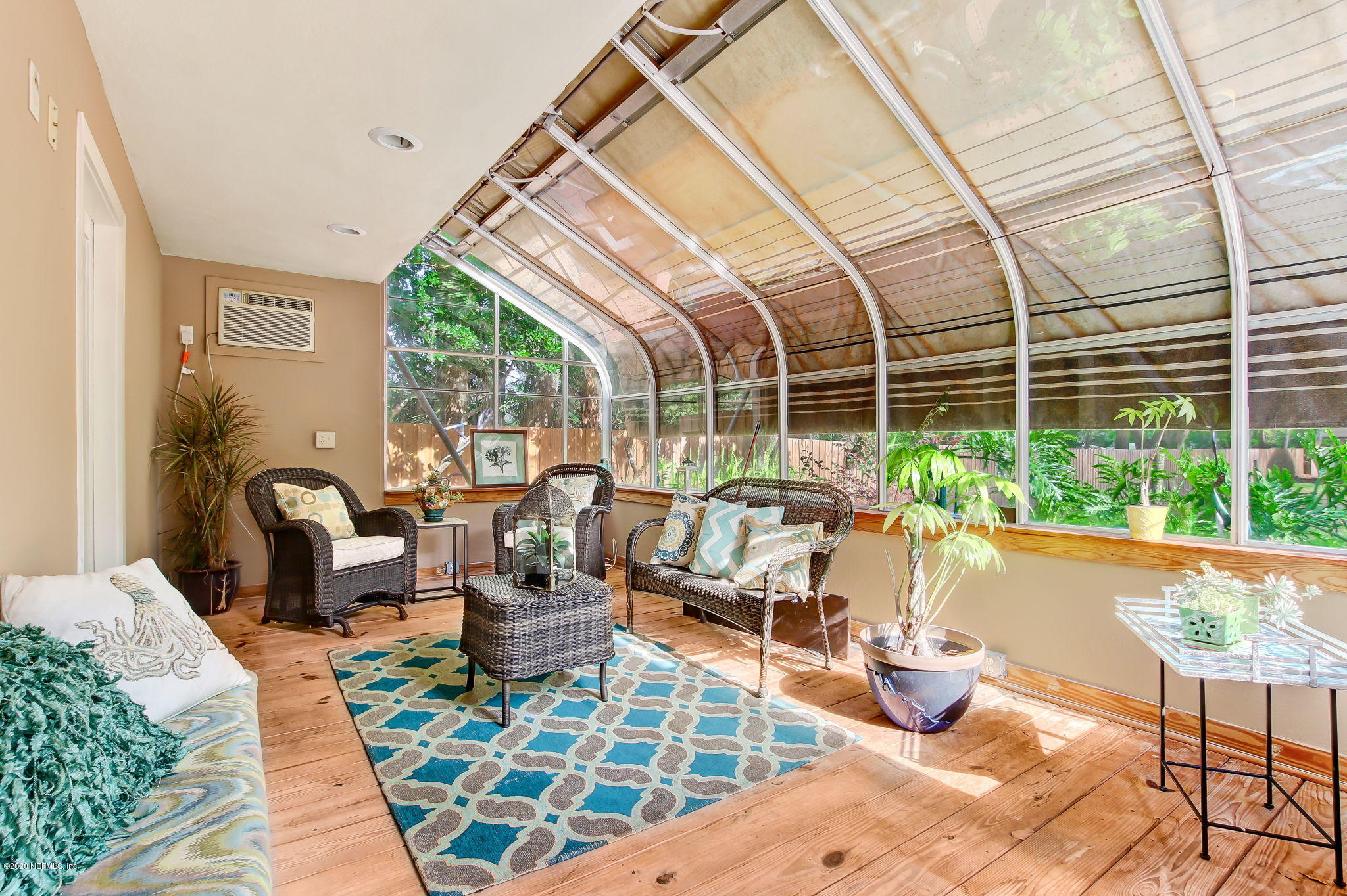 12193 Mandarin Road Jacksonville, FL 32223 - Photo 14 of 45 a living room with patio furniture and a potted plant