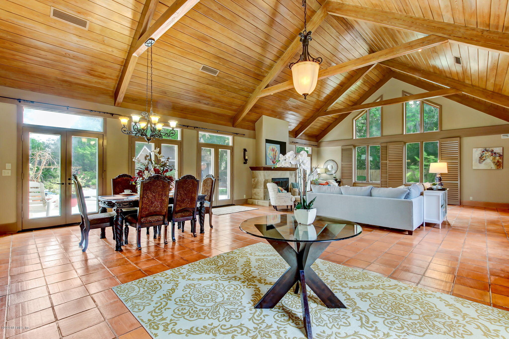 12193 Mandarin Road Jacksonville, FL 32223 - Photo 2 of 45 a dining room with furniture a chandelier and wooden floor