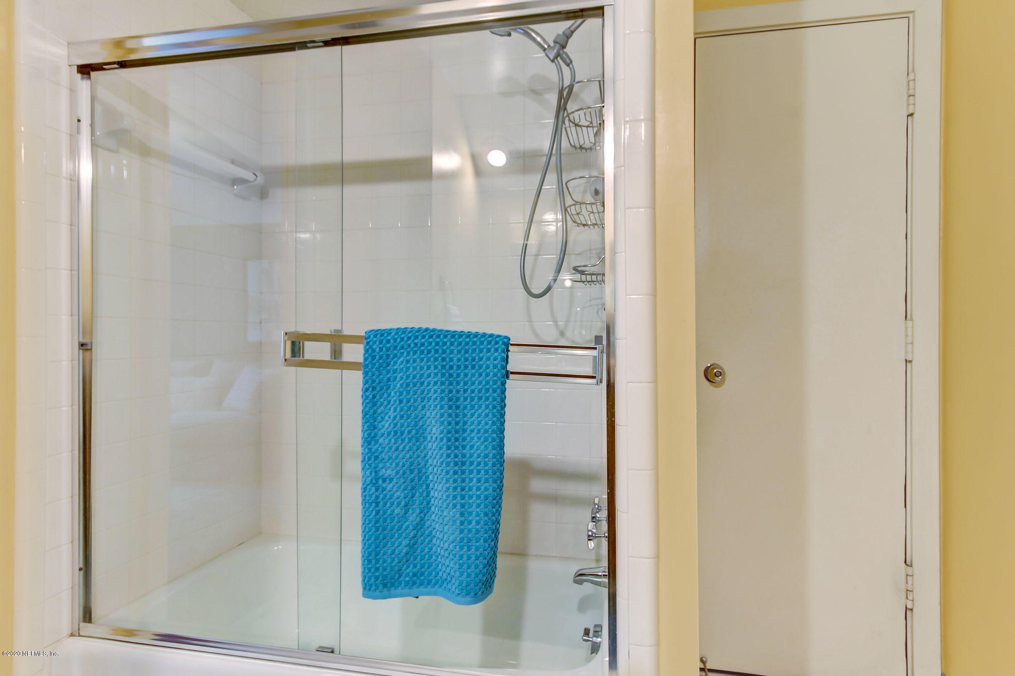 12193 Mandarin Road Jacksonville, FL 32223 - Photo 23 of 45 a bathroom with a glass shower door