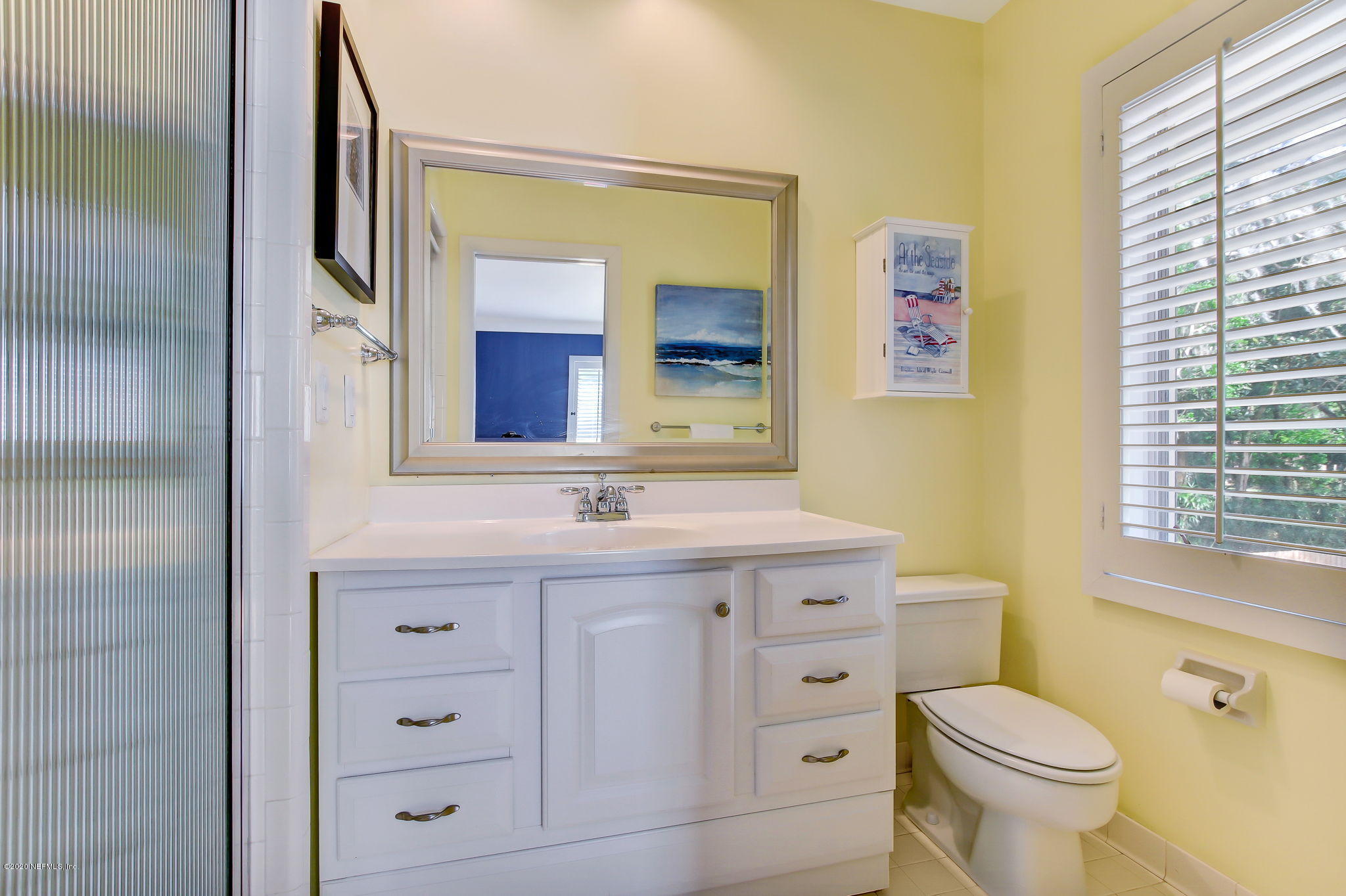 12193 Mandarin Road Jacksonville, FL 32223 - Photo 24 of 45 a bathroom with a granite countertop toilet sink and mirror