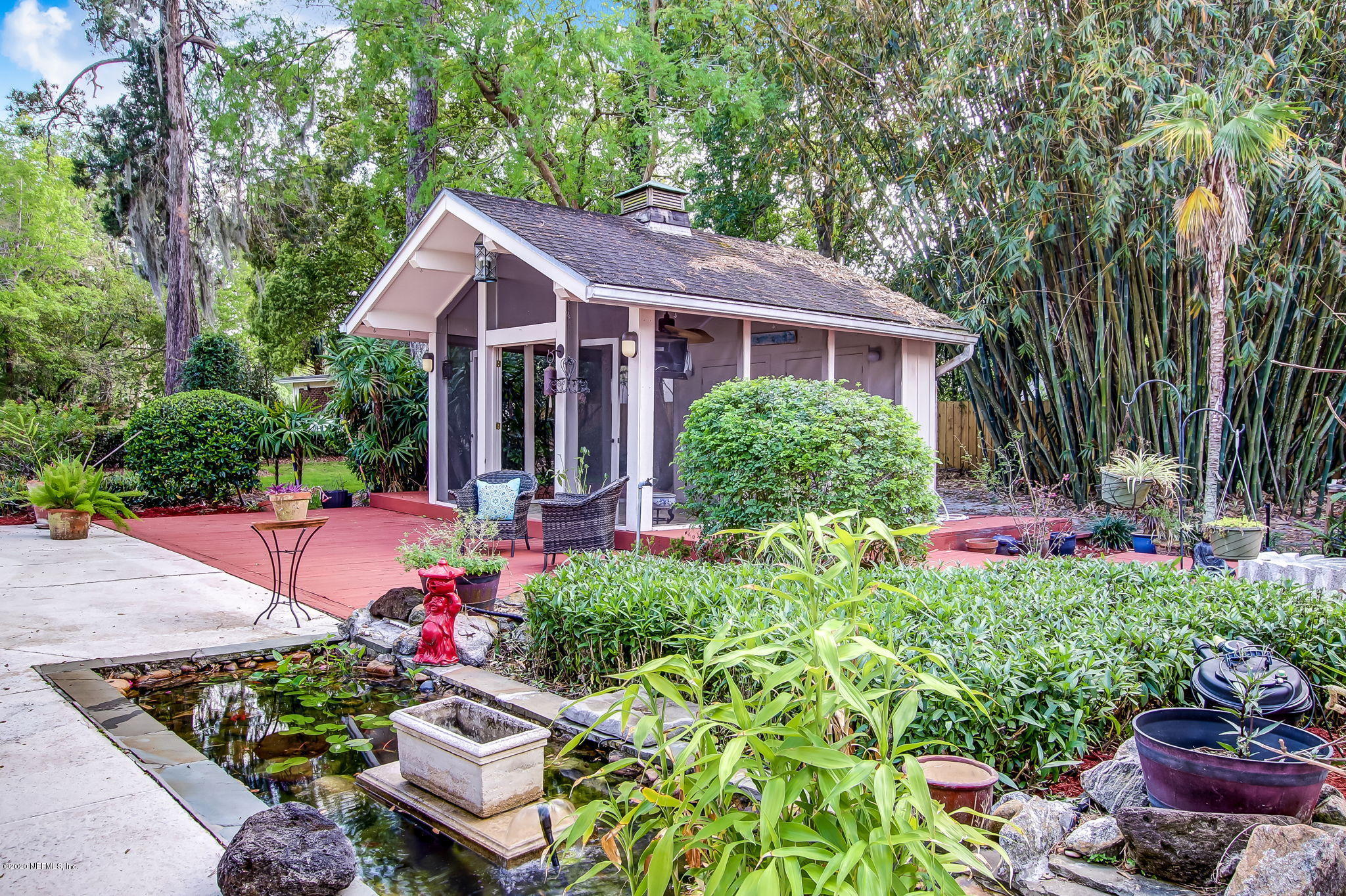 12193 Mandarin Road Jacksonville, FL 32223 - Photo 26 of 45 a view of a house with a yard and garden