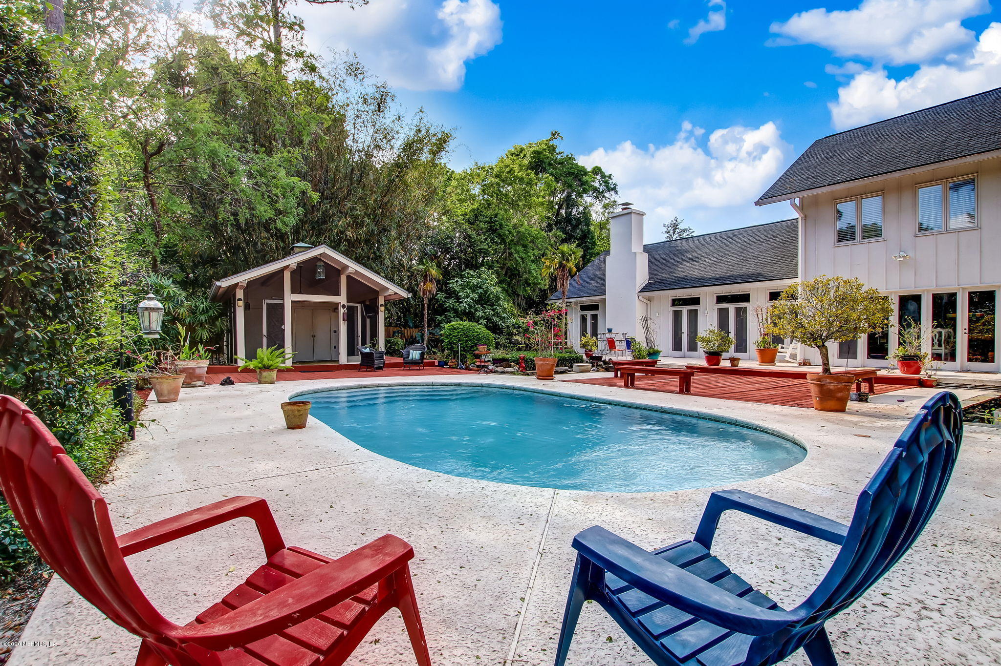 12193 Mandarin Road Jacksonville, FL 32223 - Photo 31 of 45 a view of an house with swimming pool and sitting area