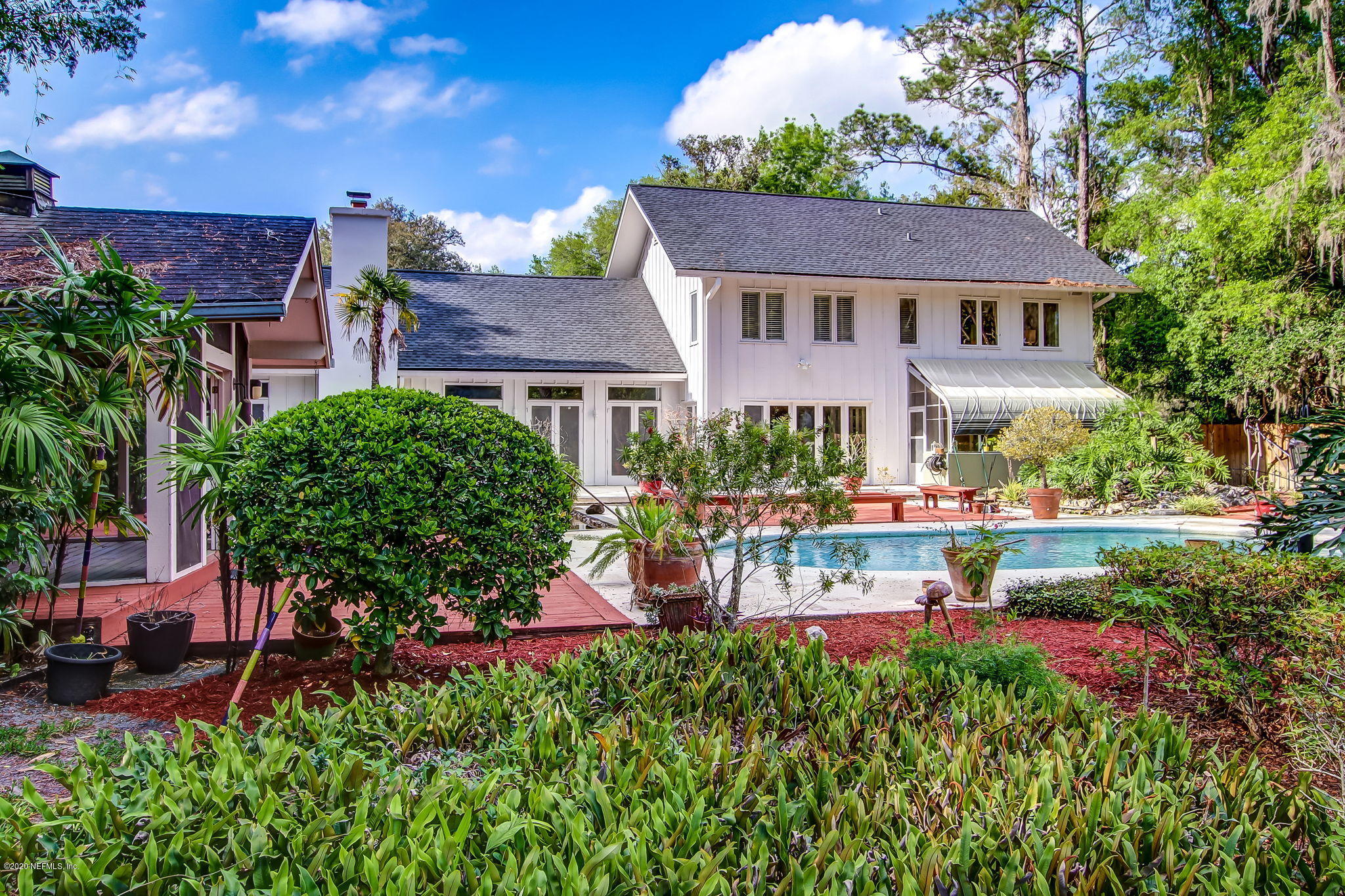 12193 Mandarin Road Jacksonville, FL 32223 - Photo 39 of 45 a view of a house with a yard and garden
