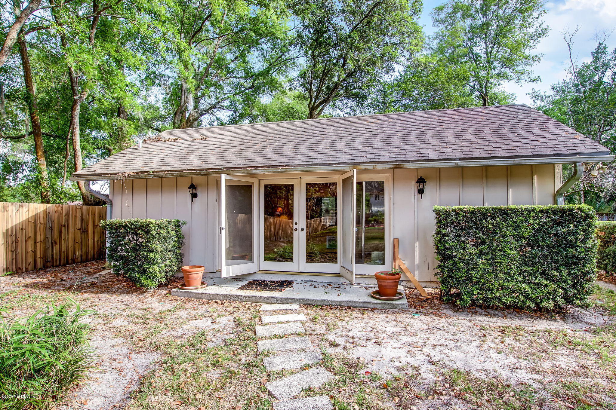 12193 Mandarin Road Jacksonville, FL 32223 - Photo 42 of 45 a front view of a house with garden