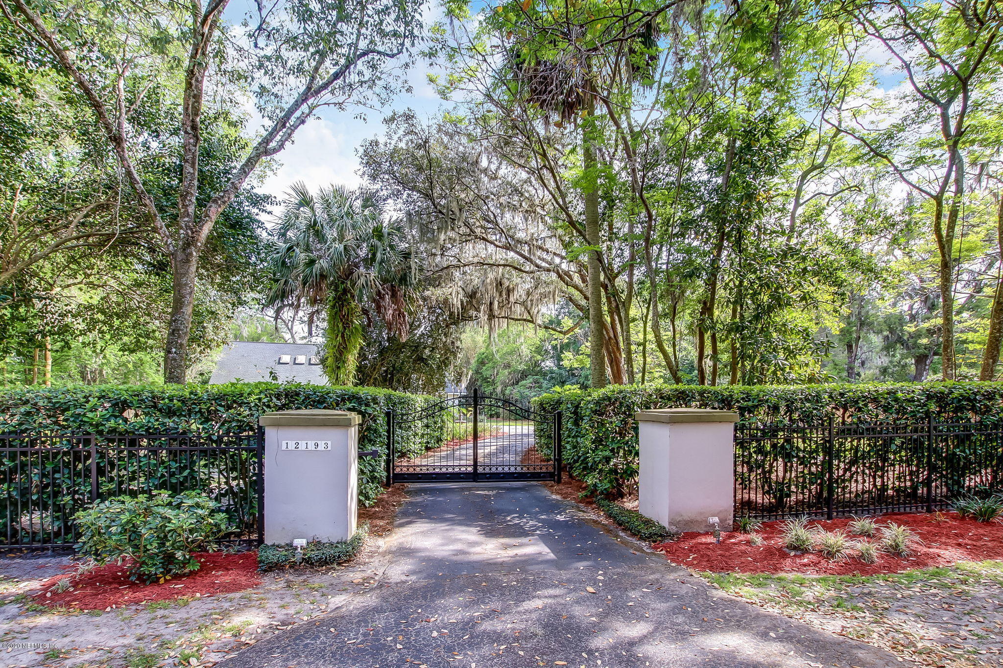 12193 Mandarin Road Jacksonville, FL 32223 - Photo 44 of 45 a view of a storage space with large trees