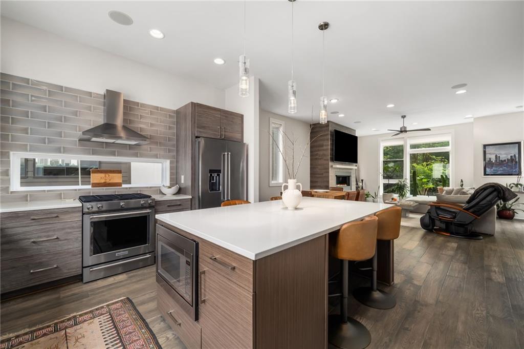 52 Reynolds Square Lane Atlanta, GA 30307 - Photo 1 of 32 a kitchen with stainless steel appliances kitchen island granite countertop a stove and a sink