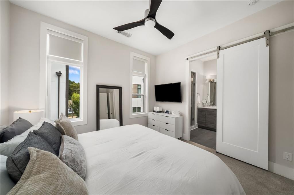 52 Reynolds Square Lane Atlanta, GA 30307 - Photo 17 of 32 a bedroom with a bed and a flat screen tv