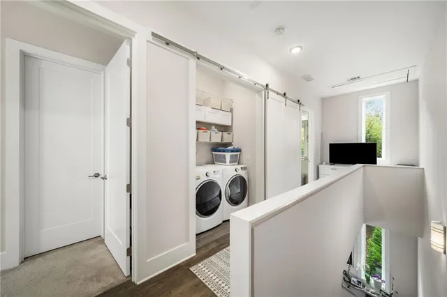 a view of a kitchen with a refrigerator and washer