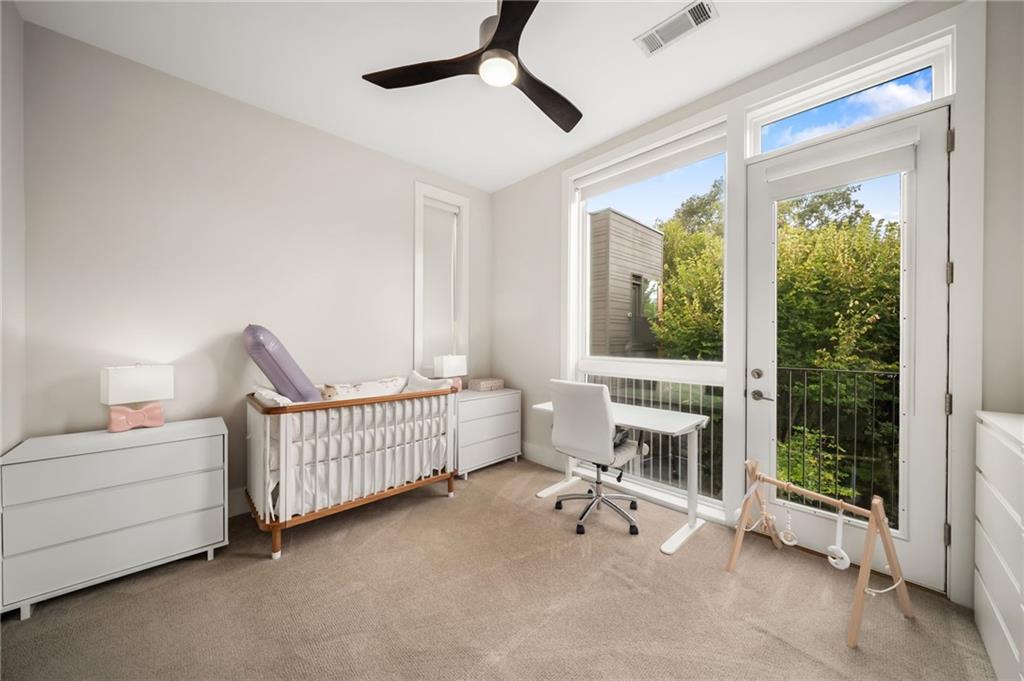 52 Reynolds Square Lane Atlanta, GA 30307 - Photo 20 of 32 a bedroom with furniture and a window