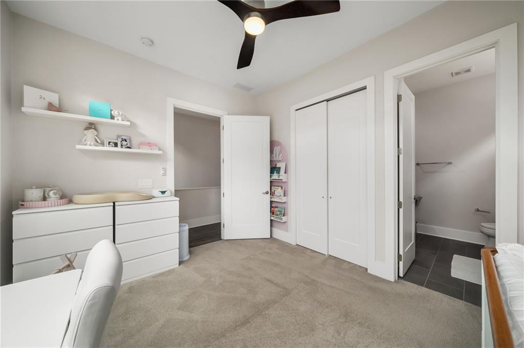 52 Reynolds Square Lane Atlanta, GA 30307 - Photo 22 of 32 a room with a white bed and dresser