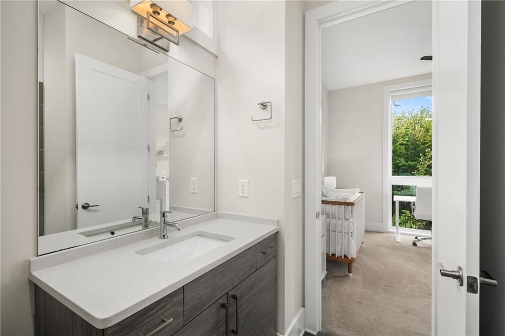 52 Reynolds Square Lane Atlanta, GA 30307 - Photo 23 of 32 a en suite bathroom with a sink and a mirror