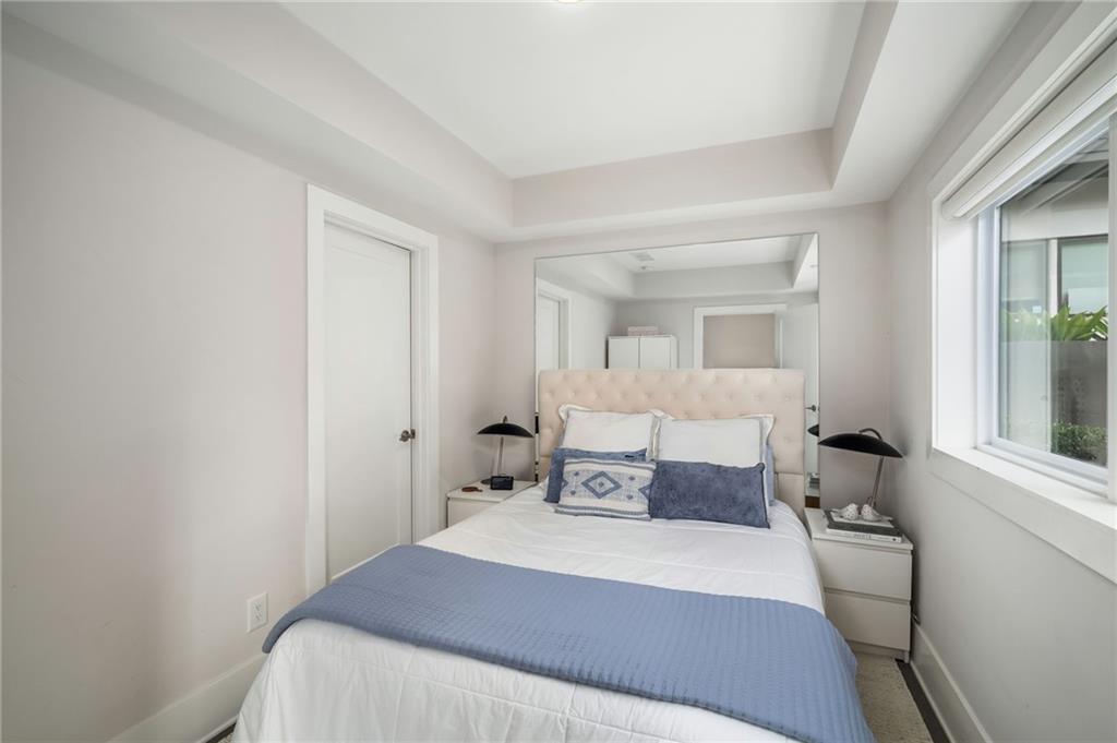 52 Reynolds Square Lane Atlanta, GA 30307 - Photo 25 of 32 a bedroom with a bed and wooden floor