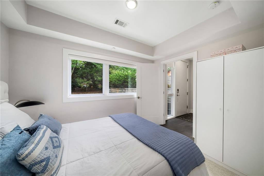52 Reynolds Square Lane Atlanta, GA 30307 - Photo 26 of 32 a bedroom with a bed and a window