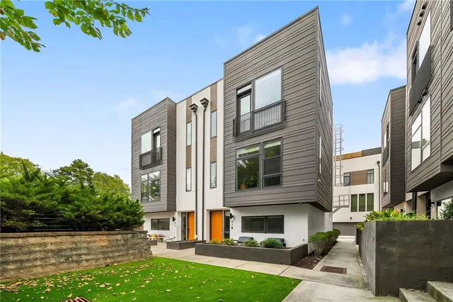 a view of a building with a yard