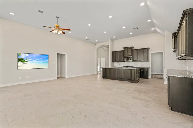 a view of a house with backyard and garden