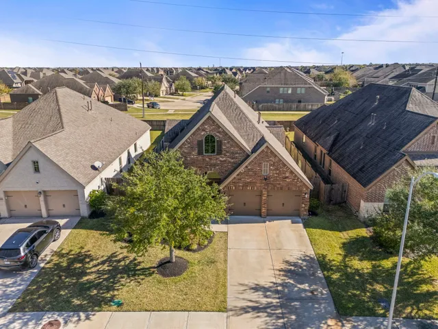 aerial view of a house with a yard