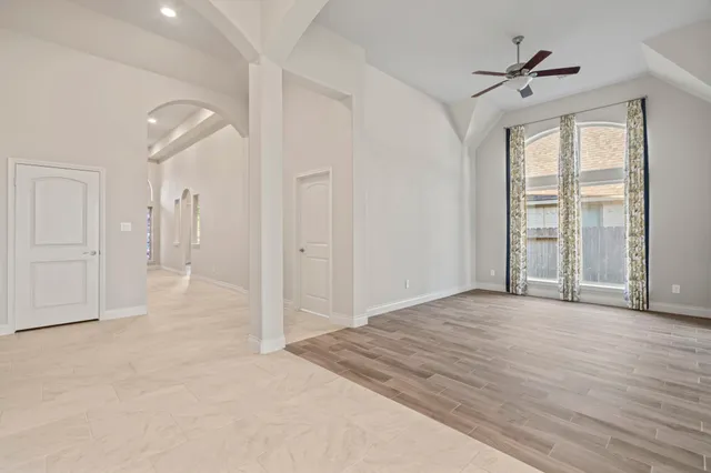 a view of an empty room with a window