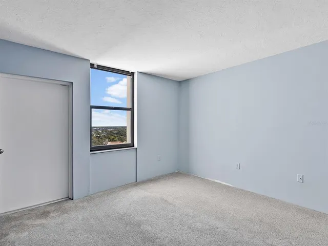 a view of a livingroom with furniture and an entryway