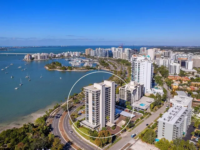 a bedroom with a large bed and a large window