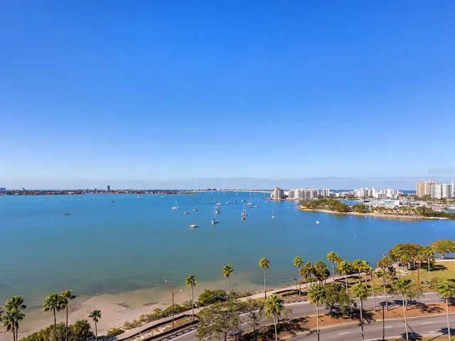 a kitchen with a sink appliances and cabinets