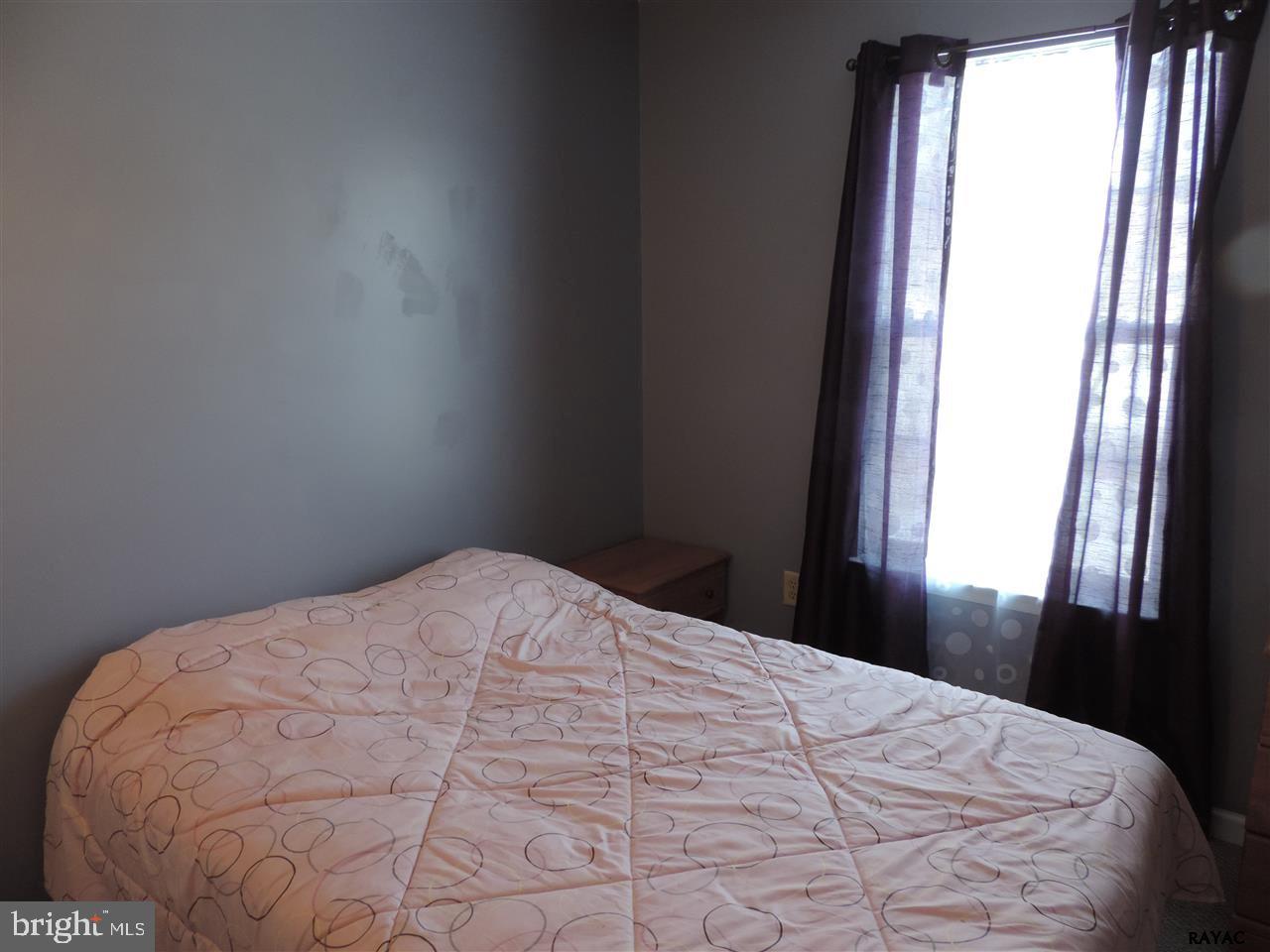 295 Elfner Road Red Lion, PA 17356 - Photo 15 of 27 a large bed sitting in a bedroom next to a window