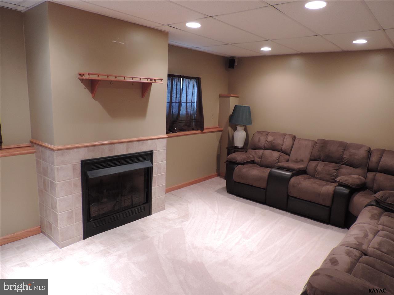295 Elfner Road Red Lion, PA 17356 - Photo 20 of 27 a living room with furniture and a fireplace