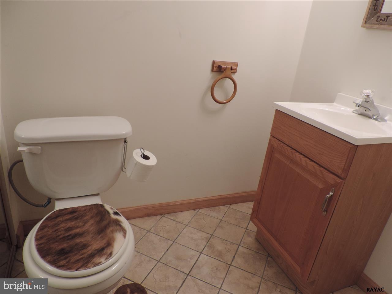295 Elfner Road Red Lion, PA 17356 - Photo 21 of 27 a bathroom with a toilet and a sink