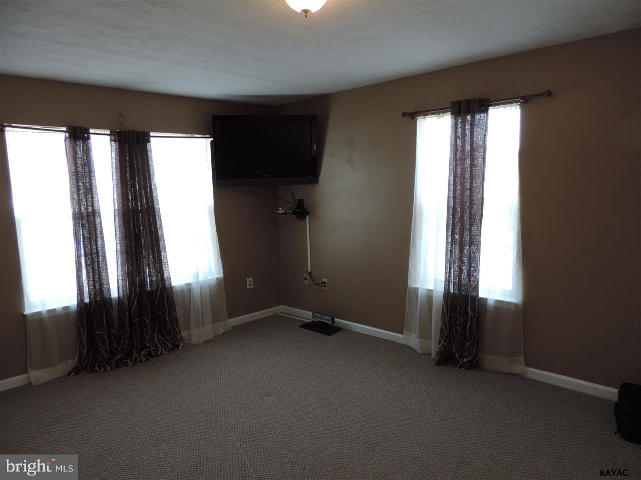 295 Elfner Road Red Lion, PA 17356 - Photo 7 of 27 an empty room with windows and closet