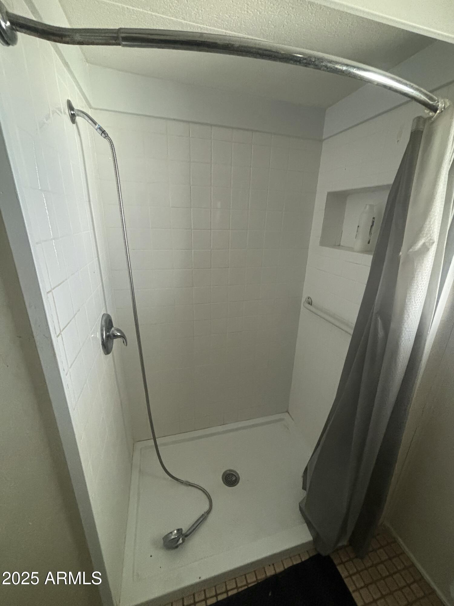 269 North Winchester Road, Unit 7 Apache Junction, AZ 85119 - Photo 11 of 26 a bathroom with a glass shower door