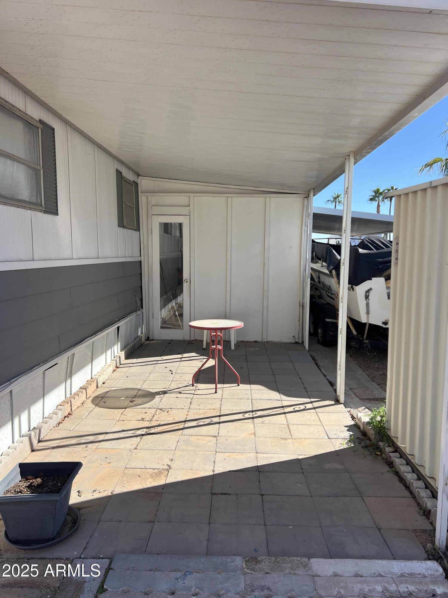 269 North Winchester Road, Unit 7 Apache Junction, AZ 85119 - Photo 17 of 26 a room with table chairs and a stove